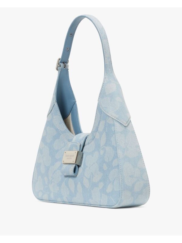 Tampilan samping tas wanita Kate Spade dengan desain ramping dan detail jahitan elegan